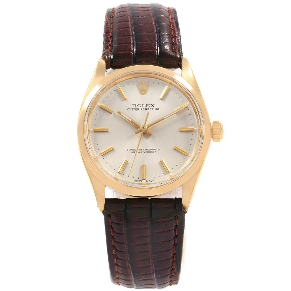 The image shows a front view of a Rolex Vintage Collection 1002 Men's Yellow Gold Silver Dial 1002 Men's Yellow Gold Silver Dial Oyster Perpetual watch with a brown leather strap and gold casing.