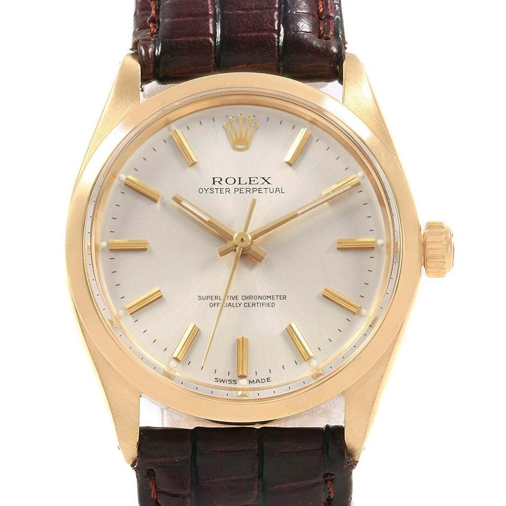 The image shows a front view of a Vintage Collection model by Rolex, highlighting the face, case, and crown with a leather strap.