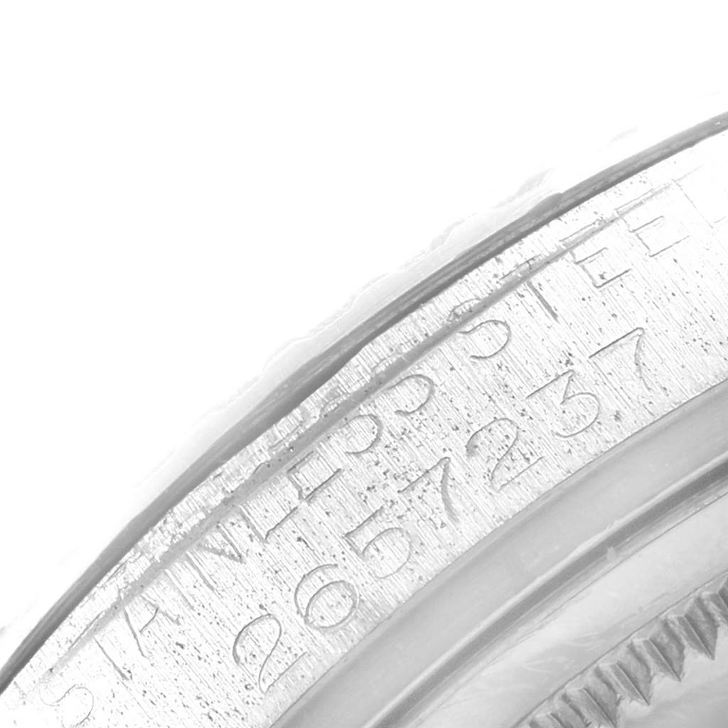 This close-up image shows the engraved serial number and stainless steel marking on the side of a Rolex Vintage Collection 1603 Men
s Stainless Steel Silver Dial 1603 Men
s Stainless Steel Silver Dial watch.