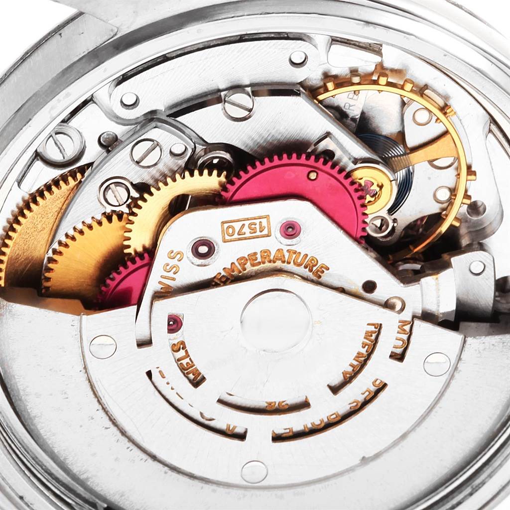 This close-up angle shows the intricate inner mechanical components of a Rolex Vintage Collection 1603 Men
s Stainless Steel Silver Dial 1603 Men
s Stainless Steel Silver Dial watch.