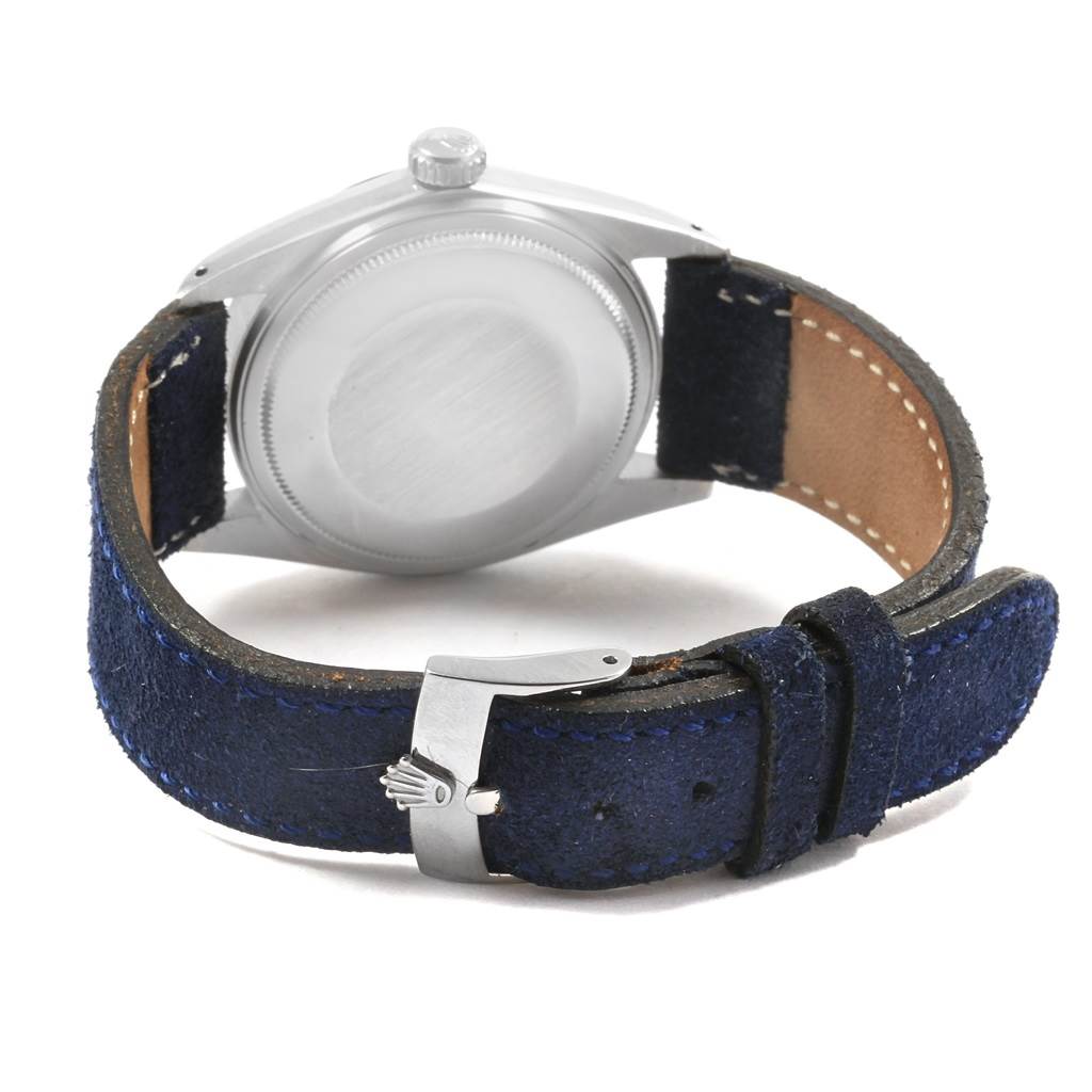 This image shows the back of a Vintage Collection Rolex watch, focusing on the case back and the buckle of the strap.