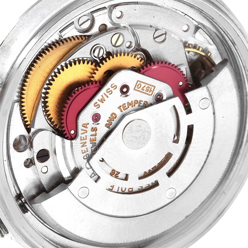 The image shows the inner mechanism of the Rolex Vintage Collection 1601 Men's Stainless Steel Silver Dial 1601 Men's Stainless Steel Silver Dial model watch, highlighting the gears and movement parts.