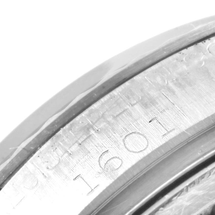 This image shows a close-up of the engraved case back of a Rolex Vintage Collection 1601 Men's Stainless Steel Silver Dial 1601 Men's Stainless Steel Silver Dial model, highlighting the model number "1601."