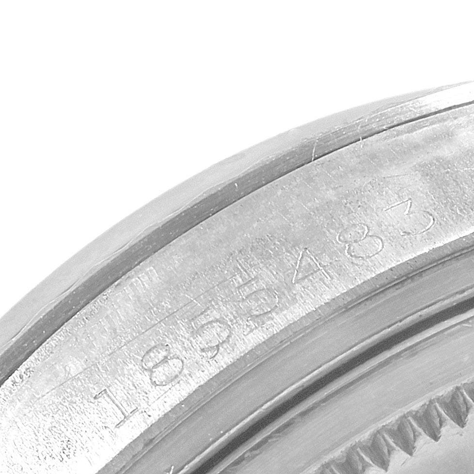 This is a close-up image of the engraved serial numbers on the caseback rim of the Rolex Vintage Collection 1601 Men's Stainless Steel Silver Dial 1601 Men's Stainless Steel Silver Dial watch.