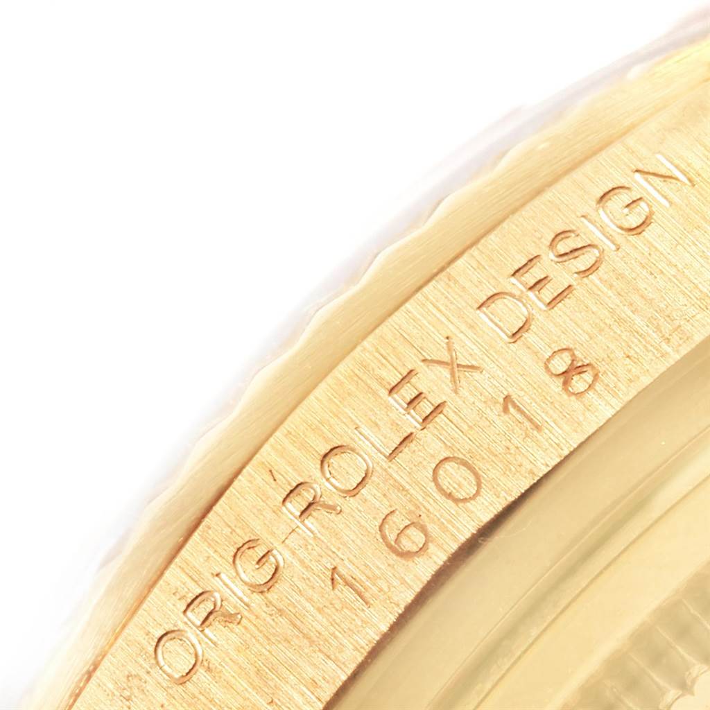 This close-up image shows the engraved bezel of a Vintage Collection Rolex watch.