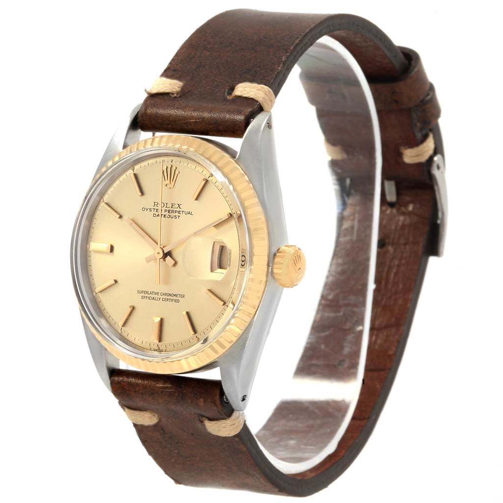 The image shows a Rolex Vintage Collection 1601 Men
s Steel and Gold (two tone) Champagne Dial 1601 Men
s Steel and Gold (two tone) Champagne Dial watch captured from a front-side angle, highlighting the dial, bezel, crown, and leather strap.