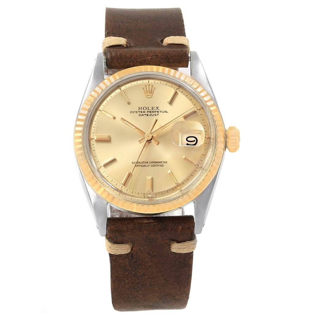 The Rolex Vintage Collection 1601 Men
s Steel and Gold (two tone) Champagne Dial 1601 Men
s Steel and Gold (two tone) Champagne Dial watch is shown from the front angle, displaying its face, bezel, crown, and leather strap.