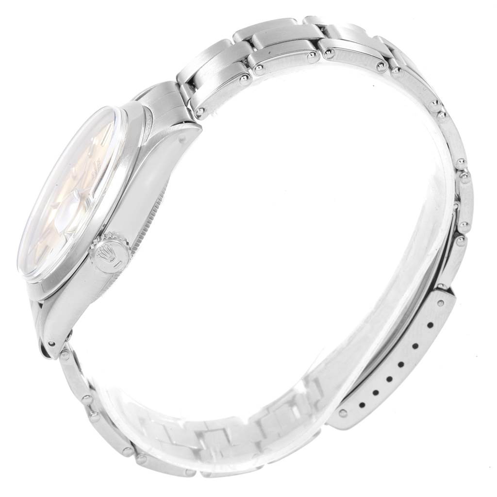 The image shows a side view of a Rolex Vintage Collection 1500 Men's Stainless Steel Silver Dial 1500 Men's Stainless Steel Silver Dial watch, highlighting its case, crown, and bracelet links.