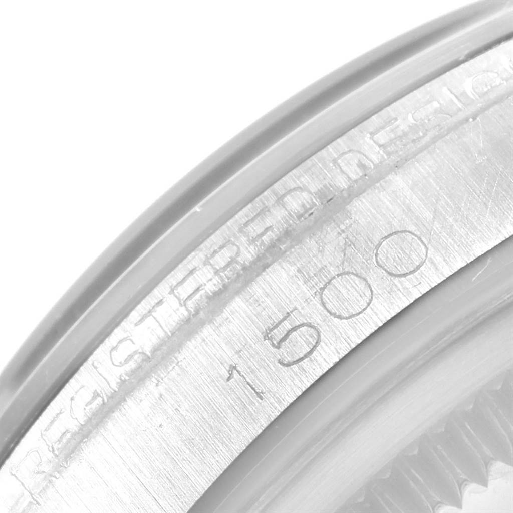 The image shows a close-up of the serial number and part of the bezel on a Rolex Vintage Collection 1500 Men's Stainless Steel Silver Dial 1500 Men's Stainless Steel Silver Dial model watch.