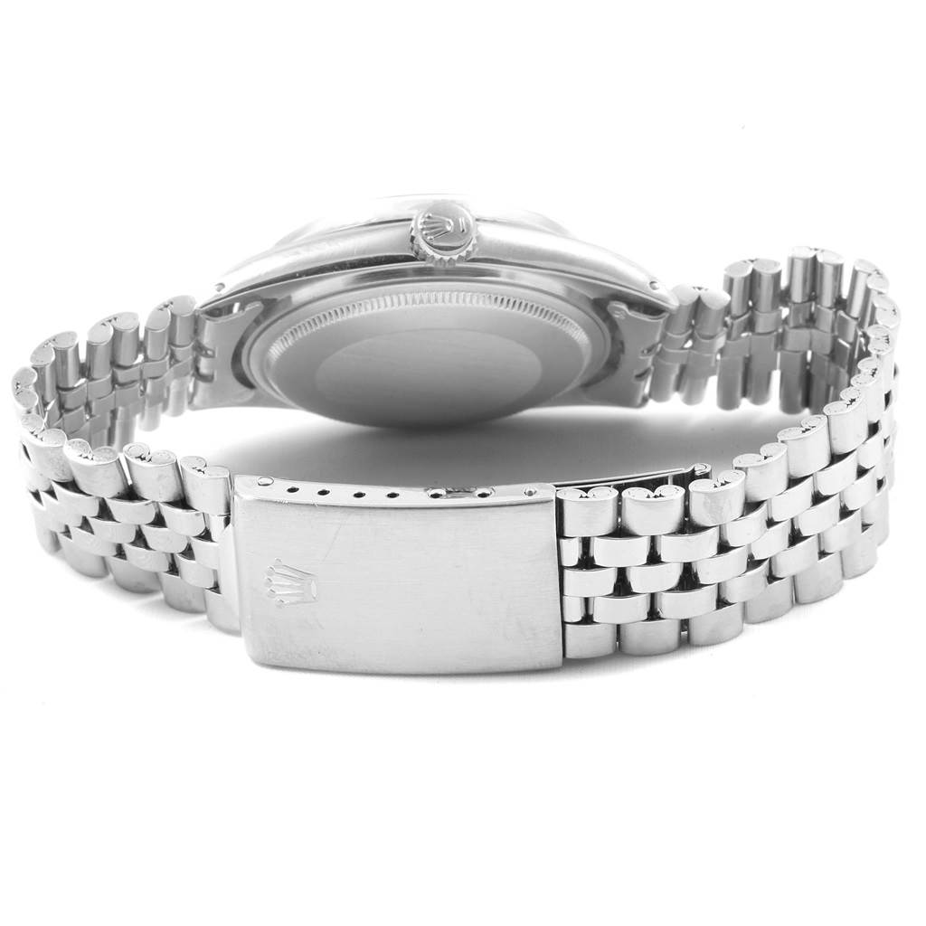 The image shows the back view of a Vintage Collection Rolex watch, focusing on the case back, crown, and bracelet clasp.