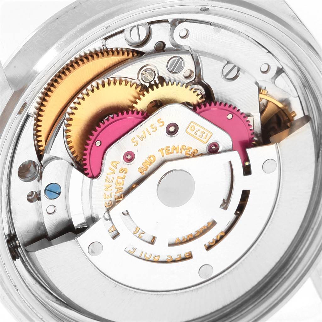 The image shows the detailed movement mechanism of the Vintage Collection model by Rolex, highlighting gears and inscriptions from the back view.
