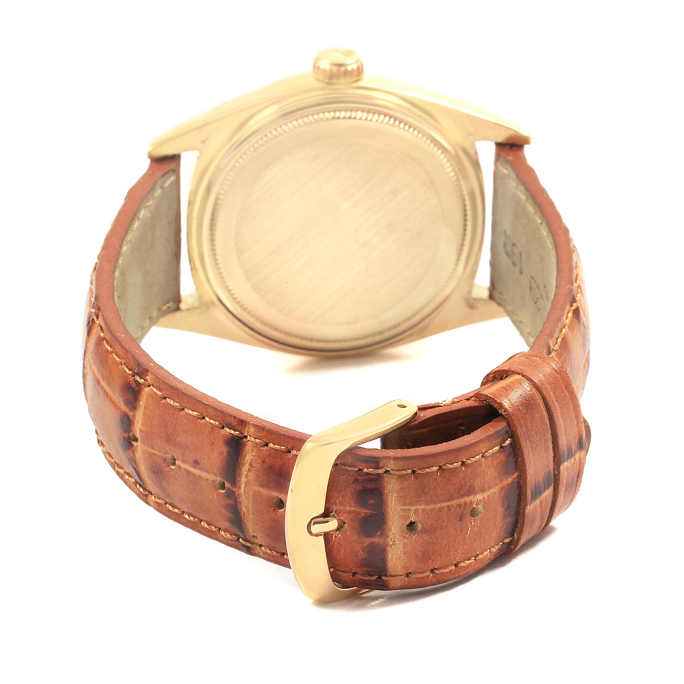 The Rolex Vintage Collection 1802 Men's Yellow Gold Champagne Dial 1802 Men's Yellow Gold Champagne Dial model watch is shown from the back, displaying its case and leather strap with a buckle.