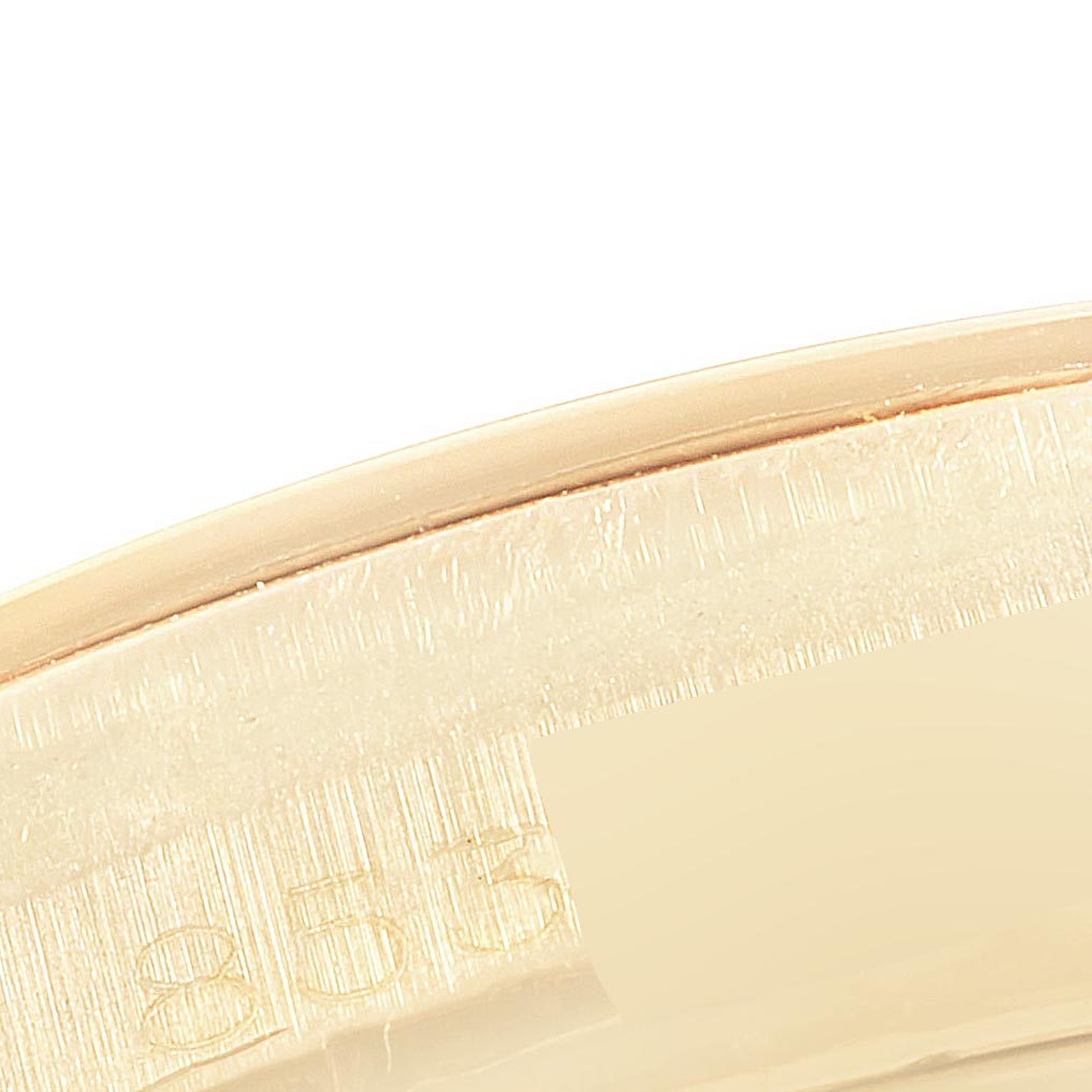 The image shows a close-up of the side edge with engraved text of the Rolex Vintage Collection 1802 Men's Yellow Gold Champagne Dial 1802 Men's Yellow Gold Champagne Dial model.