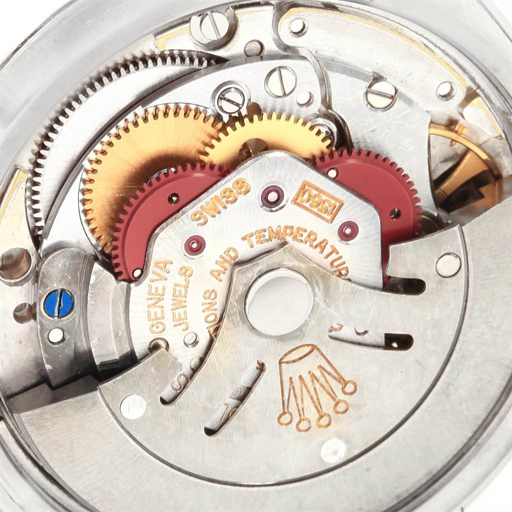 A close-up of the internal mechanical movement of the Vintage Collection model by Rolex, showing gears and intricate components.