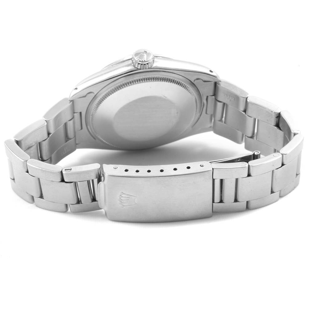 The image depicts the backside and clasp of a Rolex Vintage Collection 1500 Men
s Stainless Steel Silver Dial 1500 Men
s Stainless Steel Silver Dial model watch, showing the bracelet and case back.