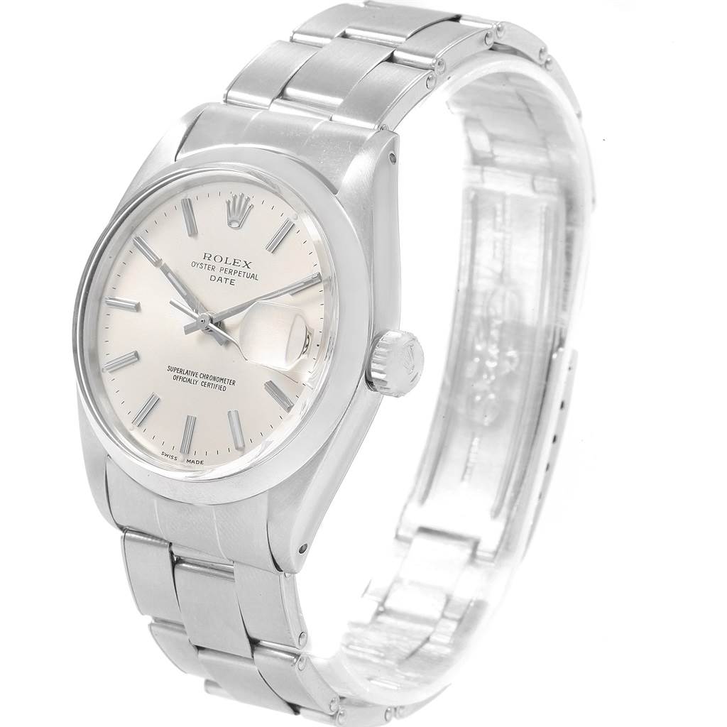 The image shows a side-angle view of a Rolex Vintage Collection 1500 Men
s Stainless Steel Silver Dial 1500 Men
s Stainless Steel Silver Dial model watch, featuring its dial, case, crown, and bracelet.