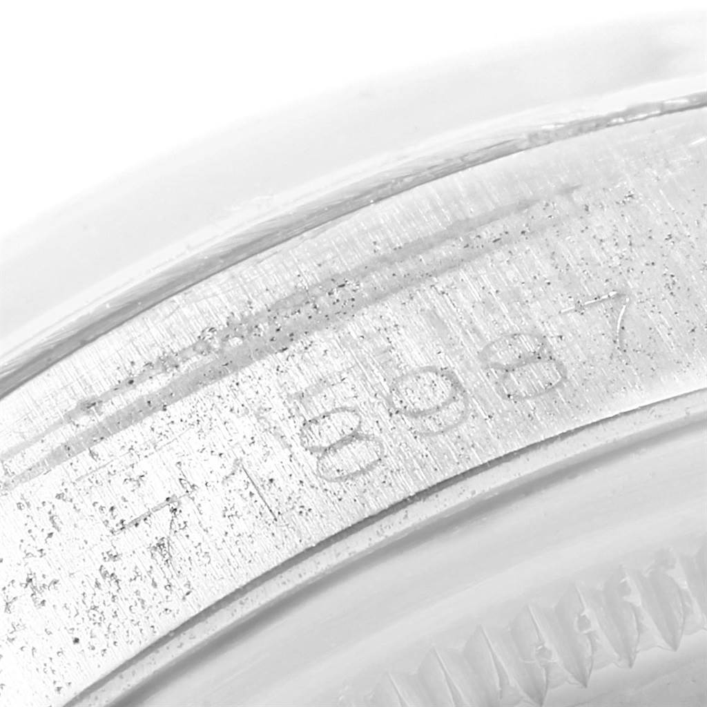 This close-up image shows the serial number engraving on the caseback rim of a Rolex Vintage Collection 1500 Men
s Stainless Steel Silver Dial 1500 Men
s Stainless Steel Silver Dial watch.