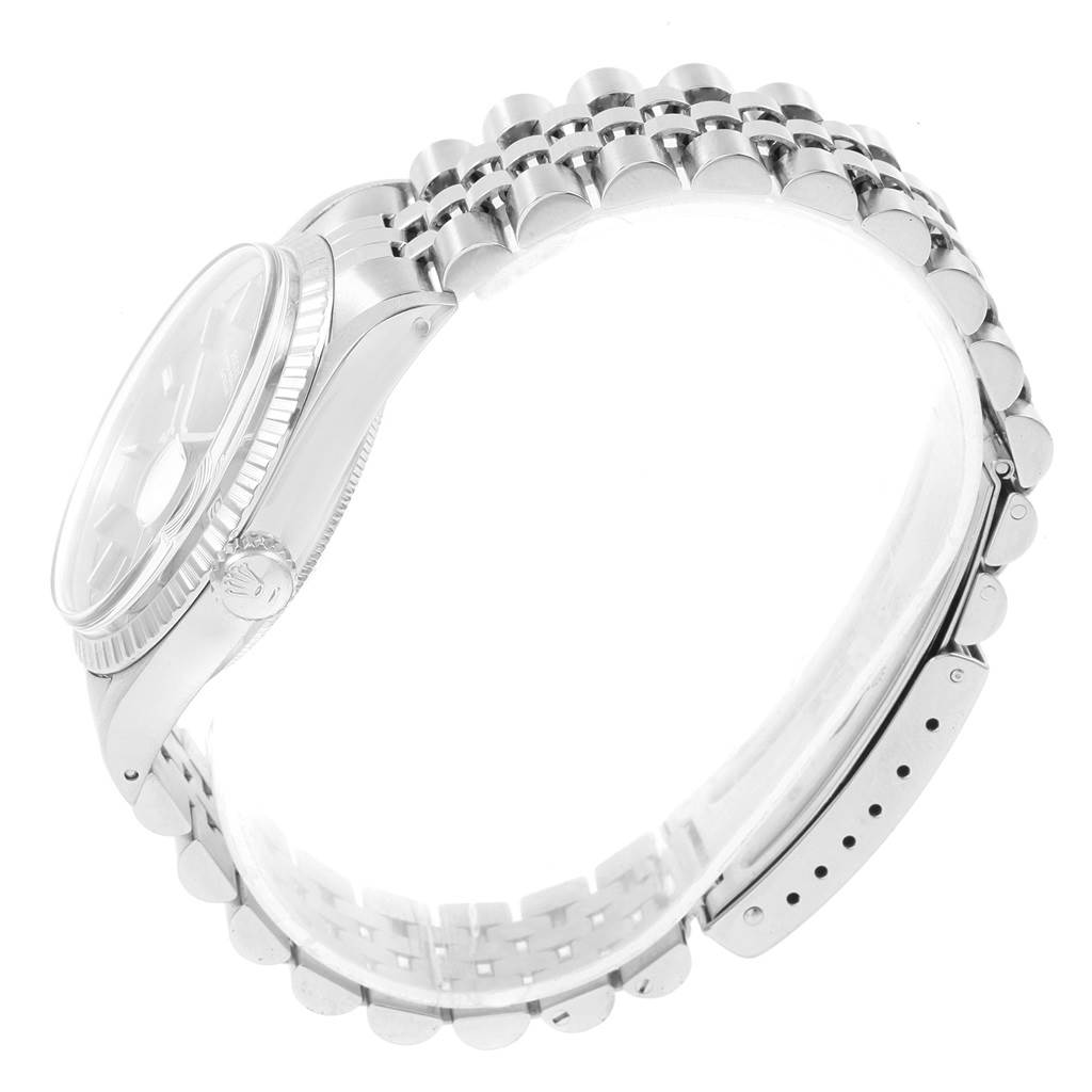 The image shows a side view of the Rolex Vintage Collection 1603 Men
s Stainless Steel Grey Dial 1603 Men
s Stainless Steel Grey Dial watch, focusing on the case, crown, and bracelet.