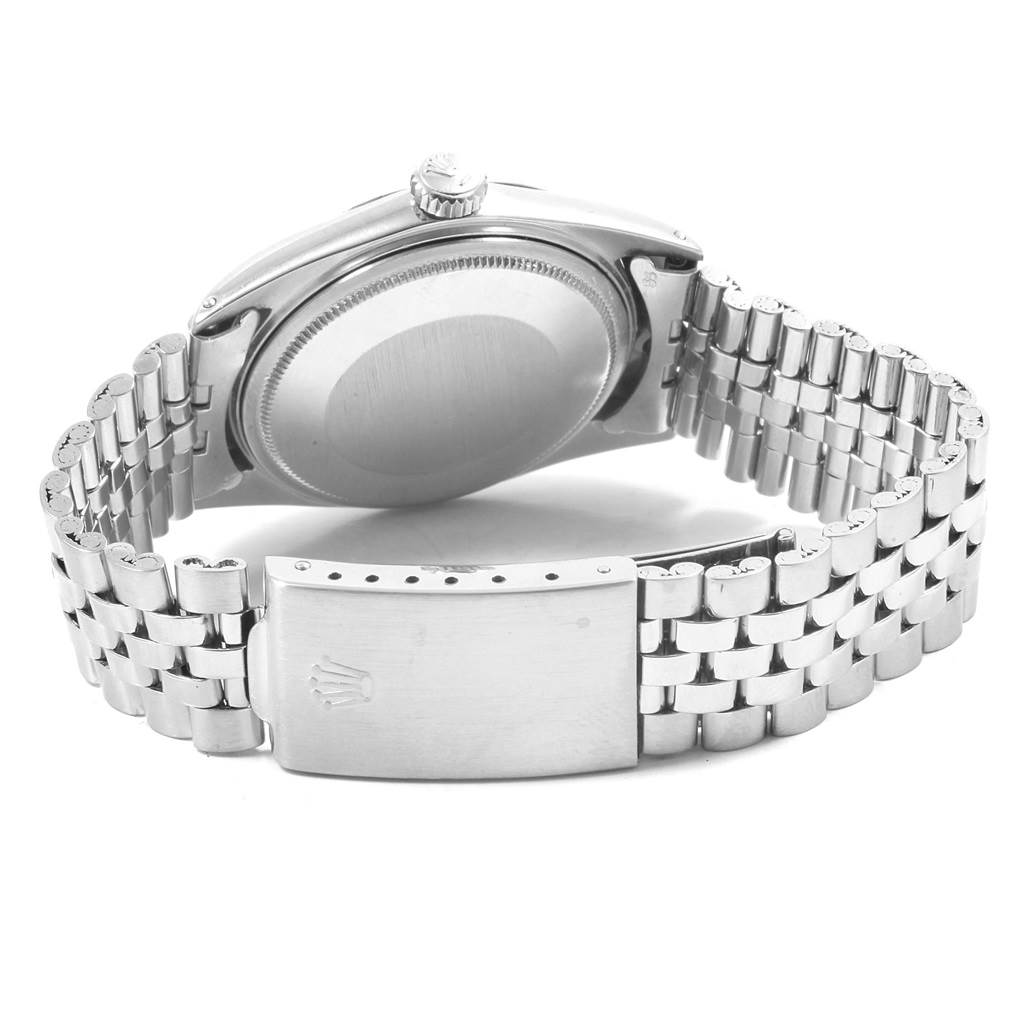 The image shows the back casing, crown, and bracelet clasp of a Rolex Vintage Collection 1601 Men
s Stainless Steel Silver Dial 1601 Men
s Stainless Steel Silver Dial model watch from an angled rear view.