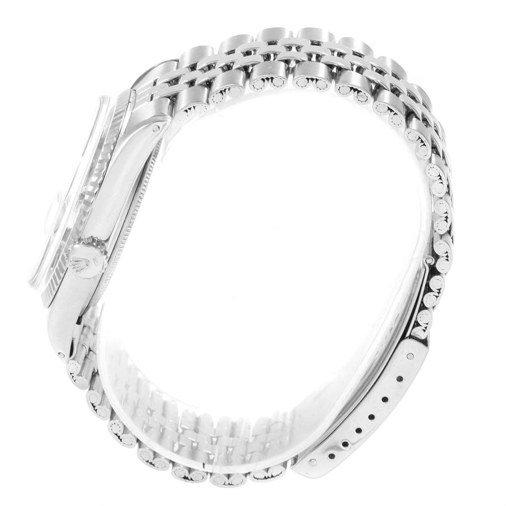 The image shows a side view of the Rolex Vintage Collection 1601 Men
s Stainless Steel Silver Dial 1601 Men
s Stainless Steel Silver Dial watch, highlighting its band, side case, crown, and partially-visible clasp.