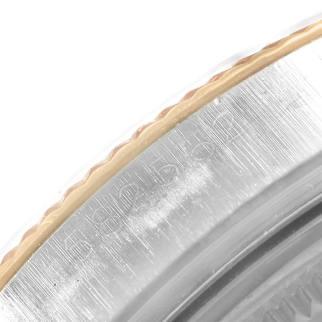 This close-up image shows the detailed edge of a Rolex Vintage Collection 1601 Men's Steel and Gold (two tone) Champagne Dial 1601 Men's Steel and Gold (two tone) Champagne Dial watch case and bezel.