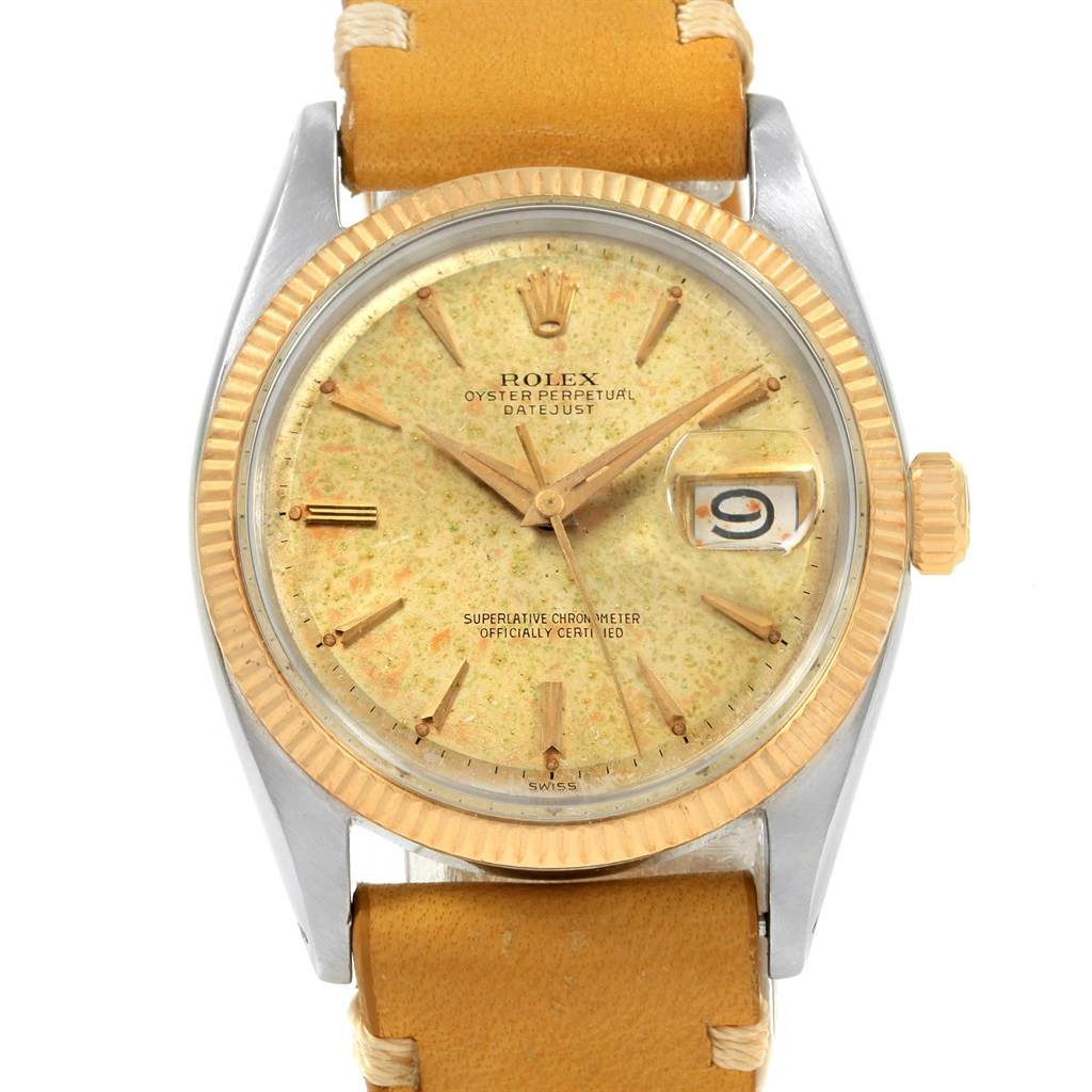 The image shows the front face of the Rolex Vintage Collection 1601 Men's Steel and Gold (two tone) Champagne Dial 1601 Men's Steel and Gold (two tone) Champagne Dial Oyster Perpetual Datejust watch with a yellowed dial and leather strap.