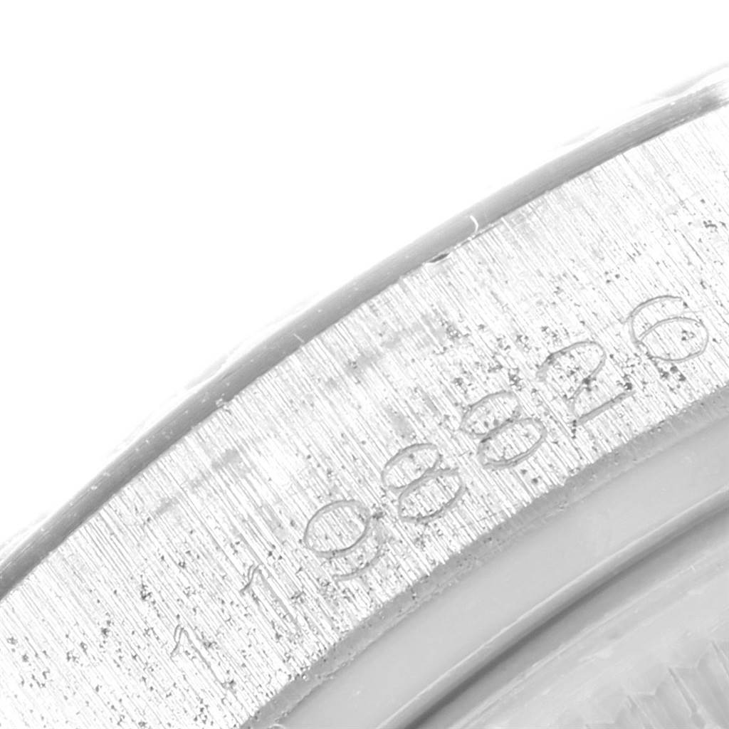 This image shows a close-up view of the engraved bezel edge of a Vintage Collection Rolex watch.