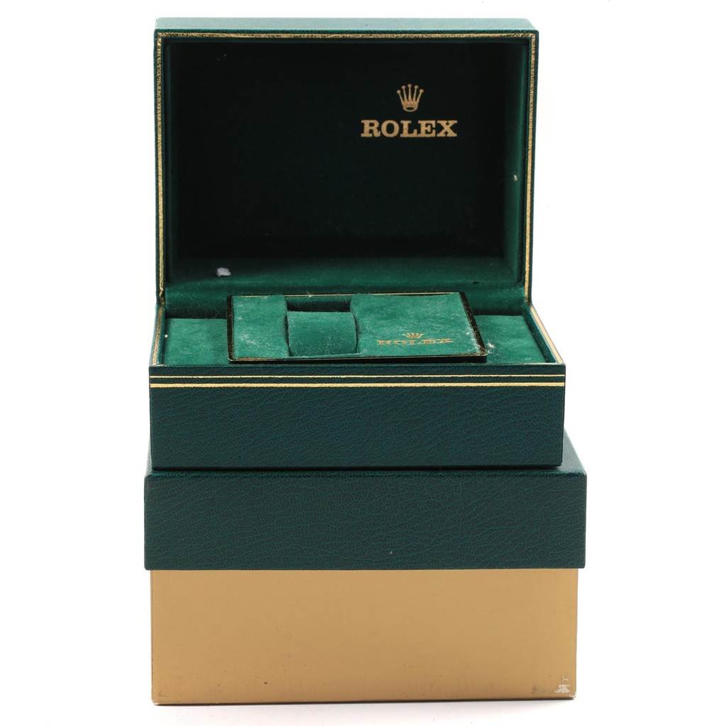 The image shows the open packaging for a Vintage Collection Rolex watch, including the inner green box and a soft pouch.