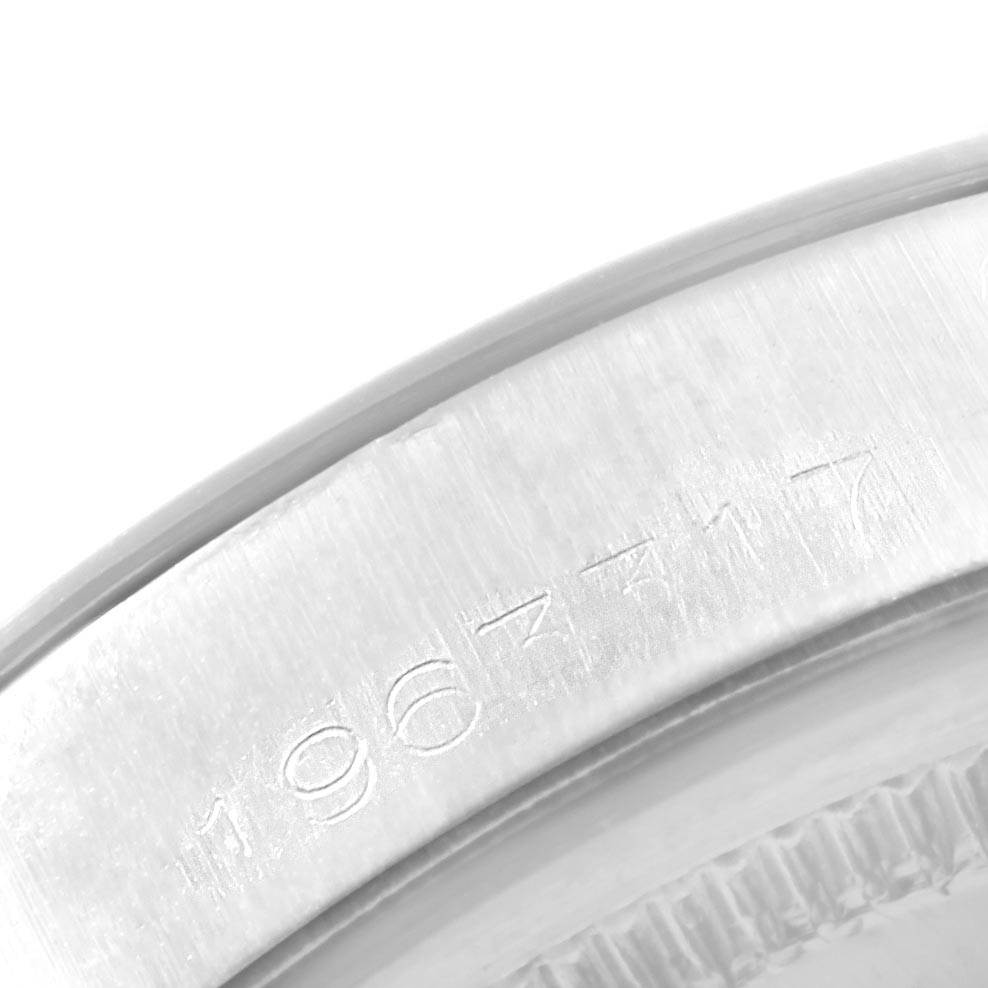 This image shows a close-up of the serial number on the case back of a Rolex Vintage Collection 1500 Men's Stainless Steel Black Dial 1500 Men's Stainless Steel Black Dial watch.