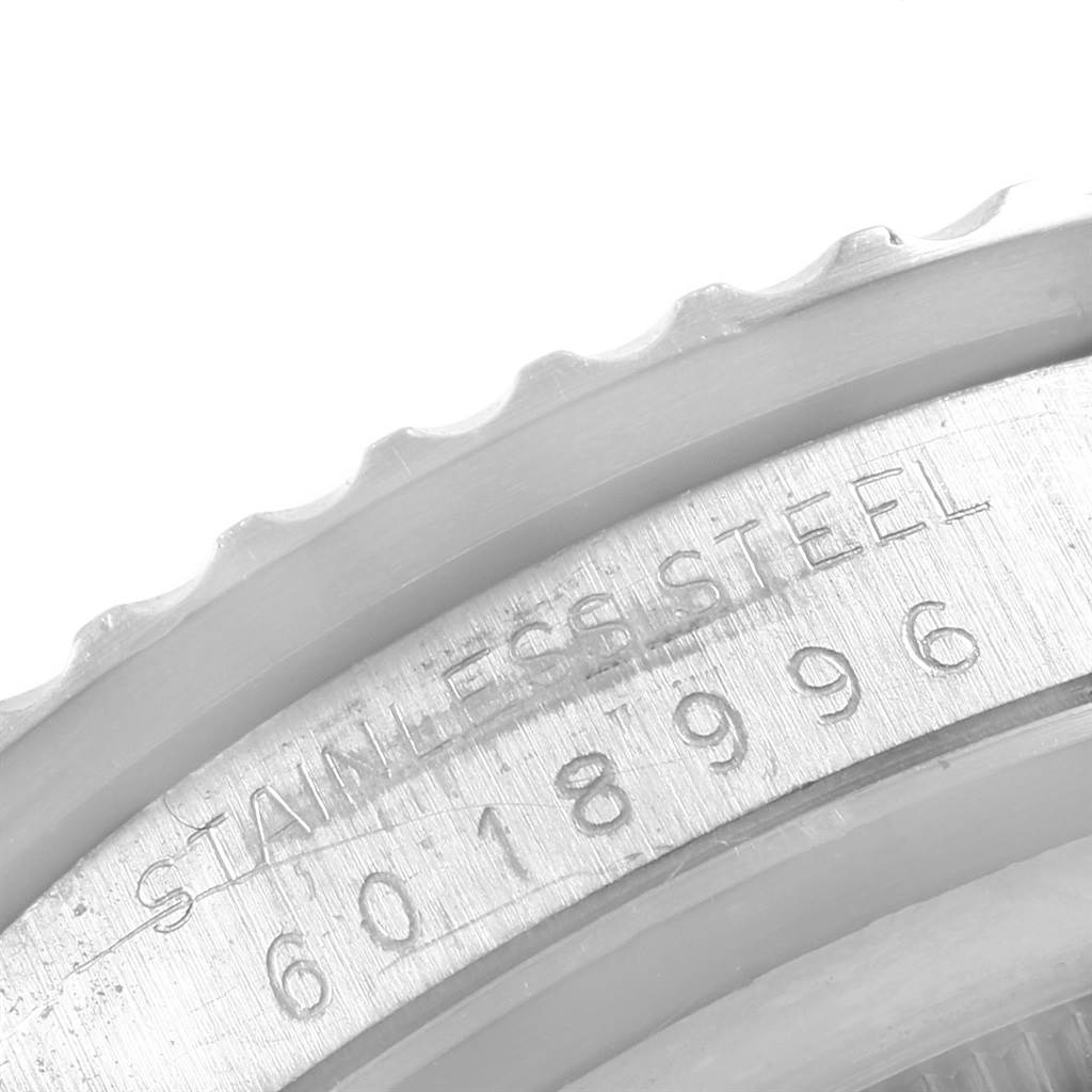 The image shows a close-up of the serial number and "STAINLESS STEEL" engraving on the bezel of a Rolex Vintage Collection 5513 Men's Stainless Steel Black Dial 5513 Men's Stainless Steel Black Dial watch.