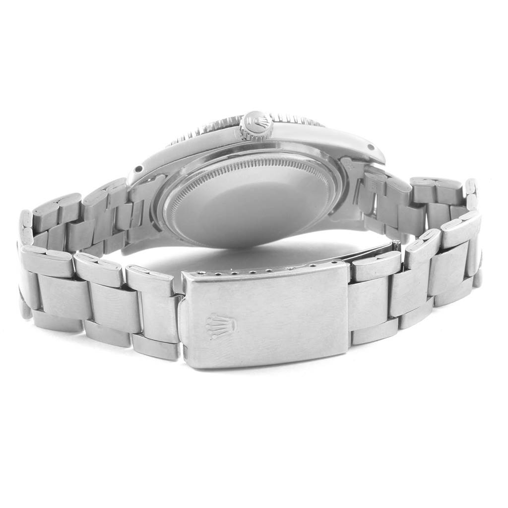 This image shows the backside and clasp of a Rolex Vintage Collection 5508 Men's Stainless Steel Black Dial 5508 Men's Stainless Steel Black Dial watch from a slightly low angle.