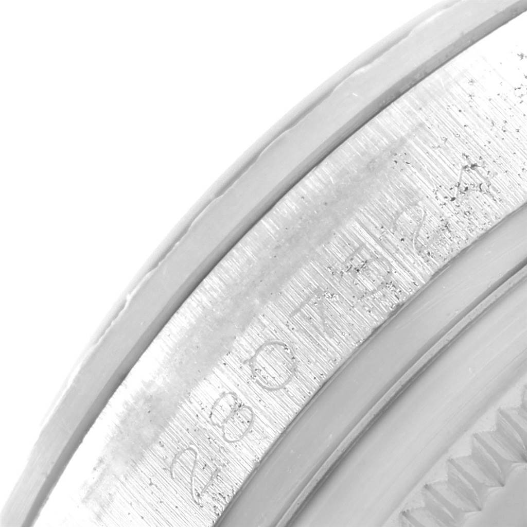 The image shows a close-up of the engraved serial number on the case edge of a Rolex Vintage Collection 1603 Men's Stainless Steel Silver Dial 1603 Men's Stainless Steel Silver Dial watch.