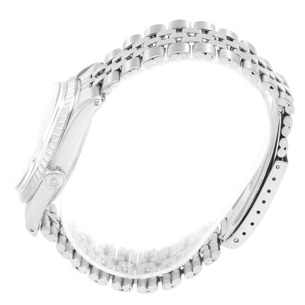 This image shows a side view of a Rolex Vintage Collection 1603 Men's Stainless Steel Silver Dial 1603 Men's Stainless Steel Silver Dial watch, focusing on the crown, bezel, and bracelet.