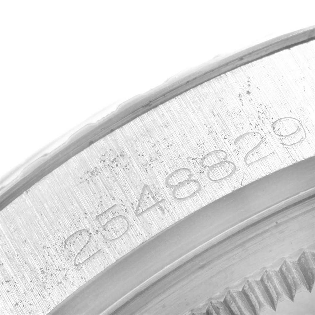 This image shows a close-up of the serial number on the case back of a Vintage Collection model by Rolex.