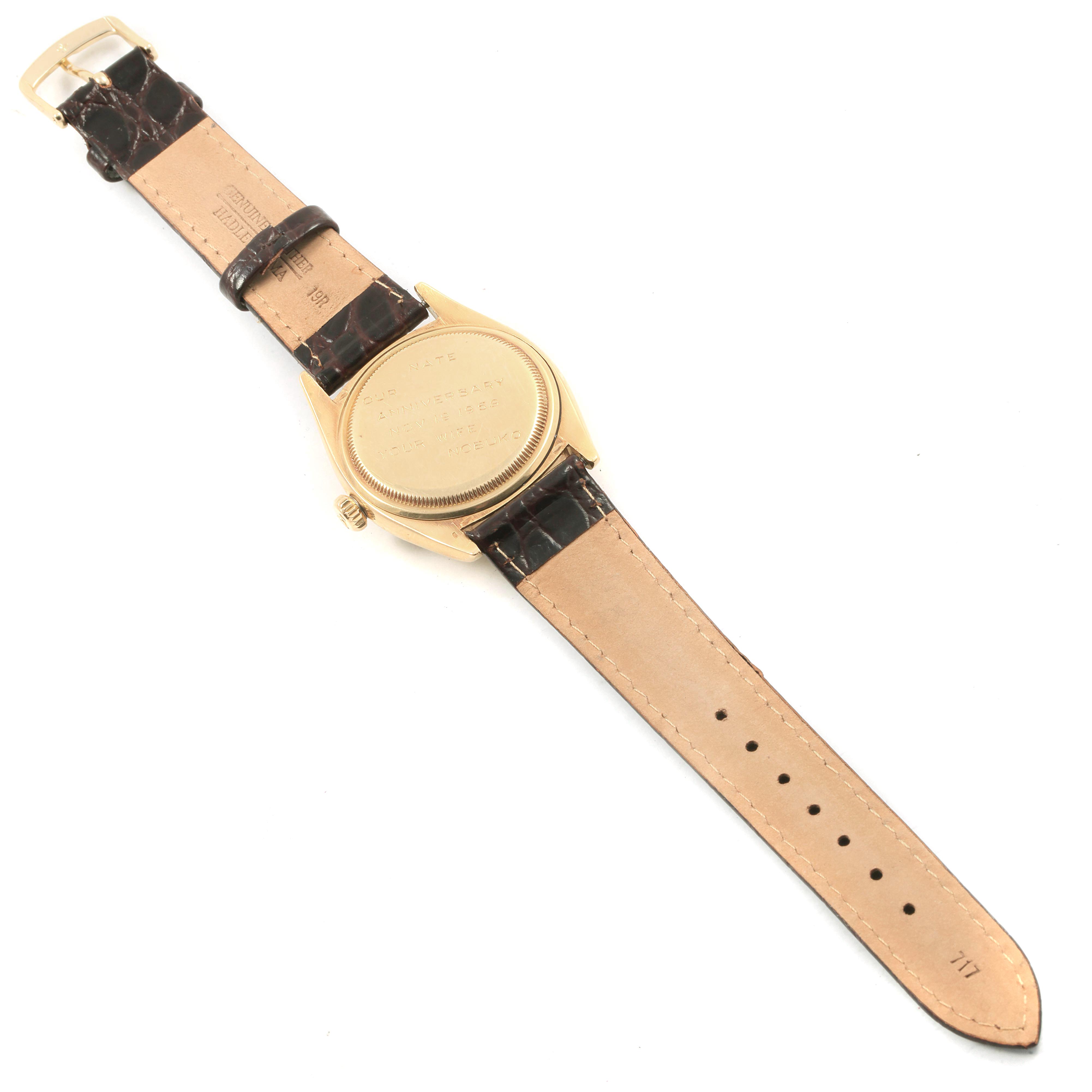 The image shows the back view of a Rolex Vintage Collection 6605 Men
s Yellow Gold Champagne Dial 6605 Men
s Yellow Gold Champagne Dial watch with a leather strap.