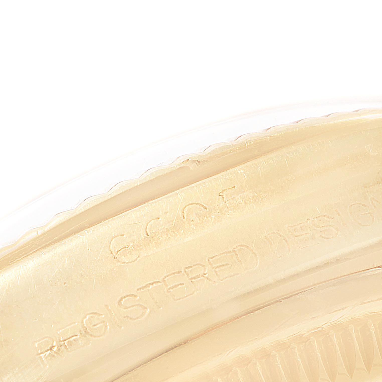 This close-up image shows the side of the bezel and part of the case back with engraved text of the Rolex Vintage Collection 6605 Men
s Yellow Gold Champagne Dial 6605 Men
s Yellow Gold Champagne Dial watch.