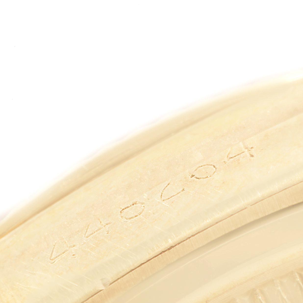 This close-up image shows the serial number etched on the case of a Vintage Collection Rolex watch.