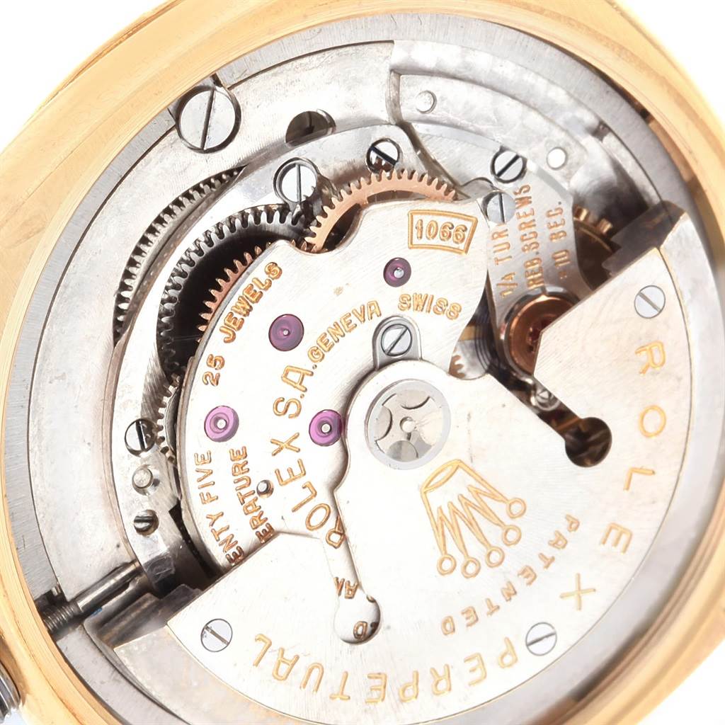 This close-up angle shows the intricate movement and inner components of the Rolex Vintage Collection 6605 Men
s Yellow Gold Champagne Dial 6605 Men
s Yellow Gold Champagne Dial watch.
