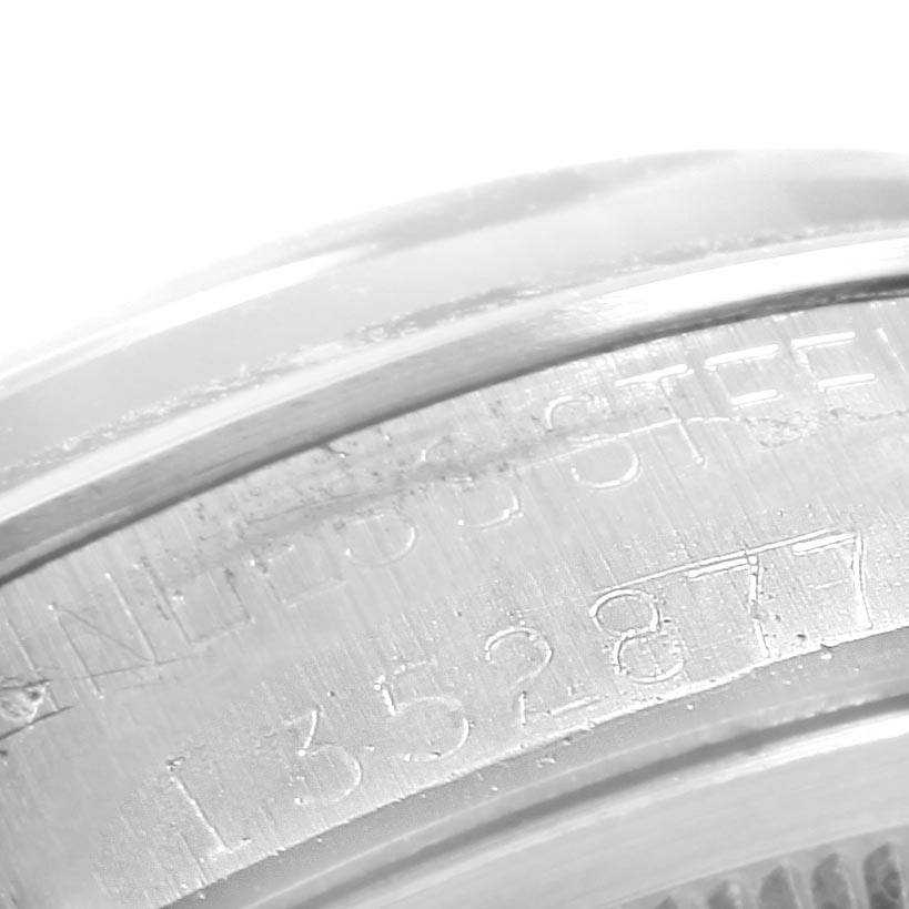 This close-up image shows the engraved serial number on the case back of a Vintage Collection Rolex watch.