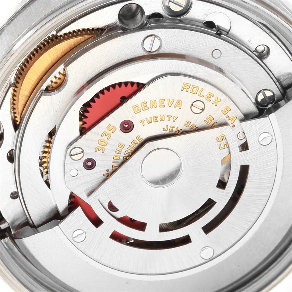 This image shows a close-up view of the movement mechanism of a Rolex Vintage Collection 15000 Men's Stainless Steel Black Dial 15000 Men's Stainless Steel Black Dial watch.