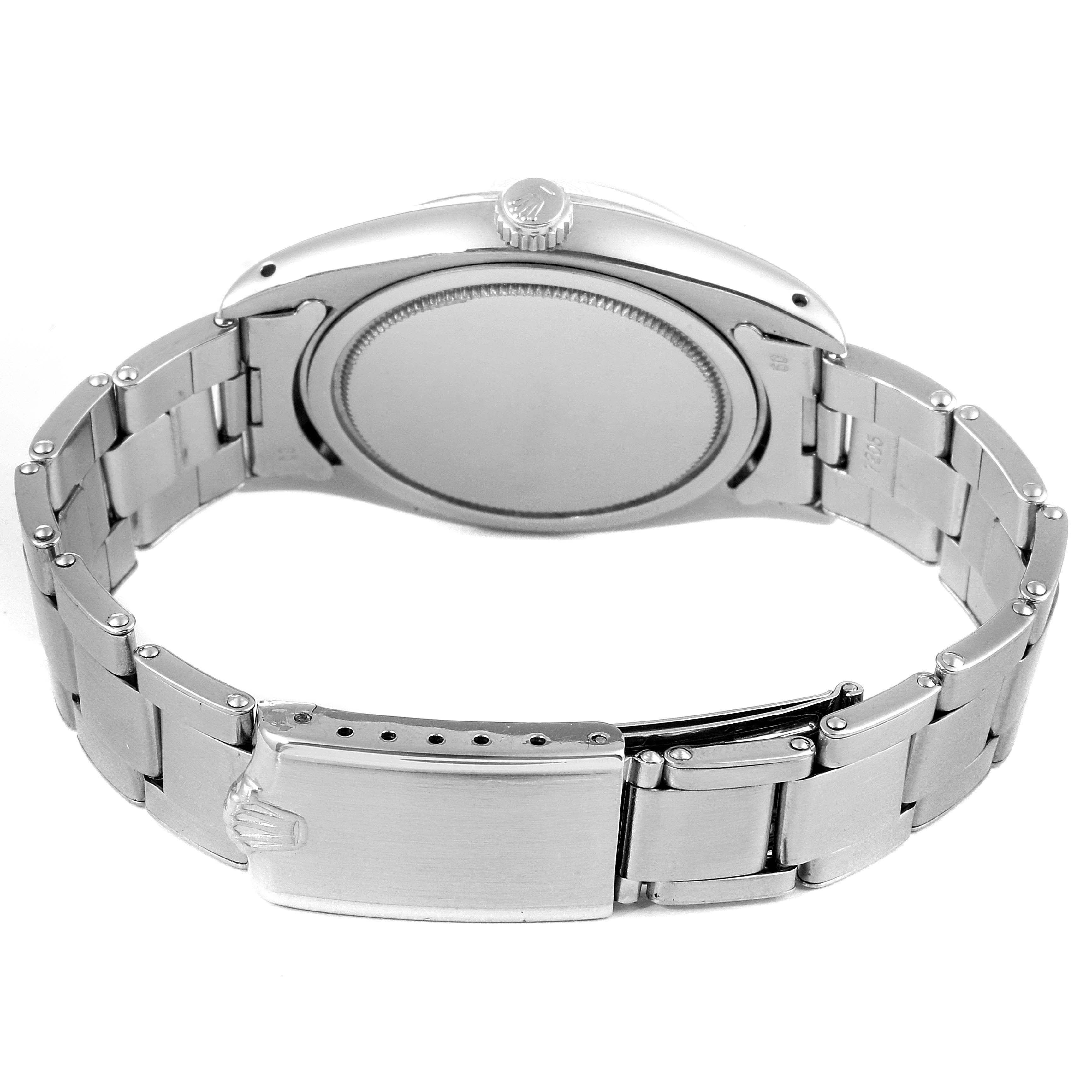 The image shows the back view of a Rolex Vintage Collection 6494 Men's Stainless Steel Silver Dial 6494 Men's Stainless Steel Silver Dial watch, highlighting the case back, crown, and bracelet clasp.