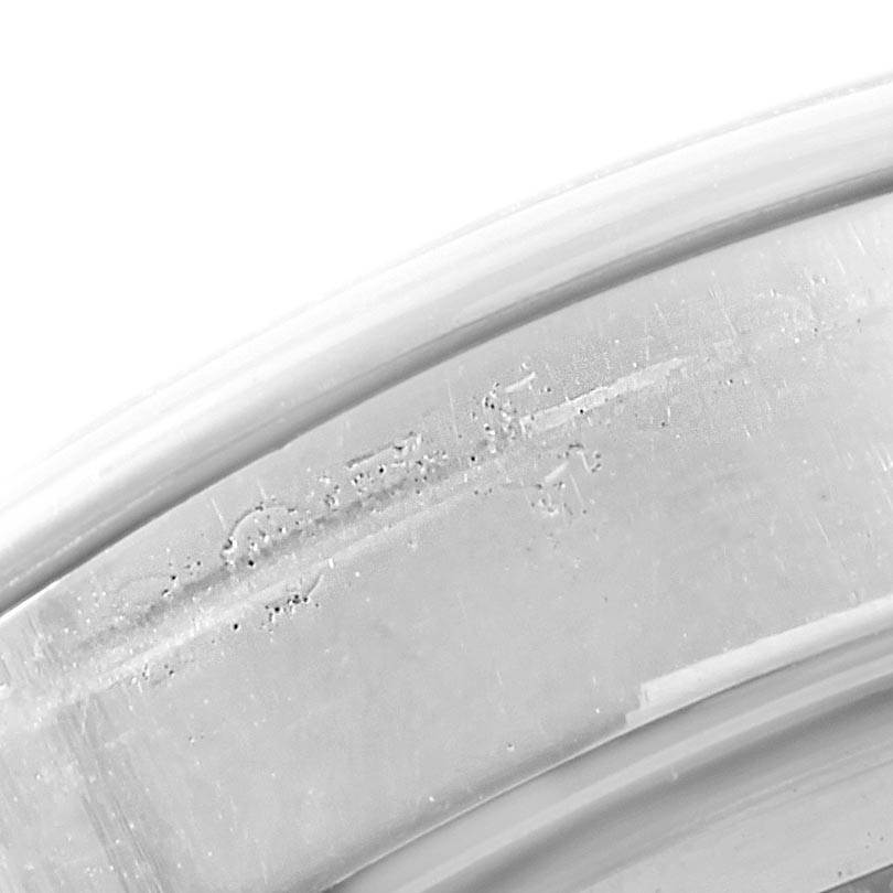This image shows an angled close-up of the inner case back of a Vintage Collection model by Rolex.