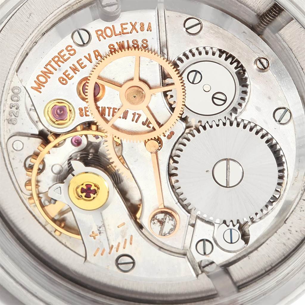 The image shows a close-up of the internal mechanism of the Rolex Vintage Collection 6494 Men's Stainless Steel Silver Dial 6494 Men's Stainless Steel Silver Dial watch, focusing on its gears and intricate components.