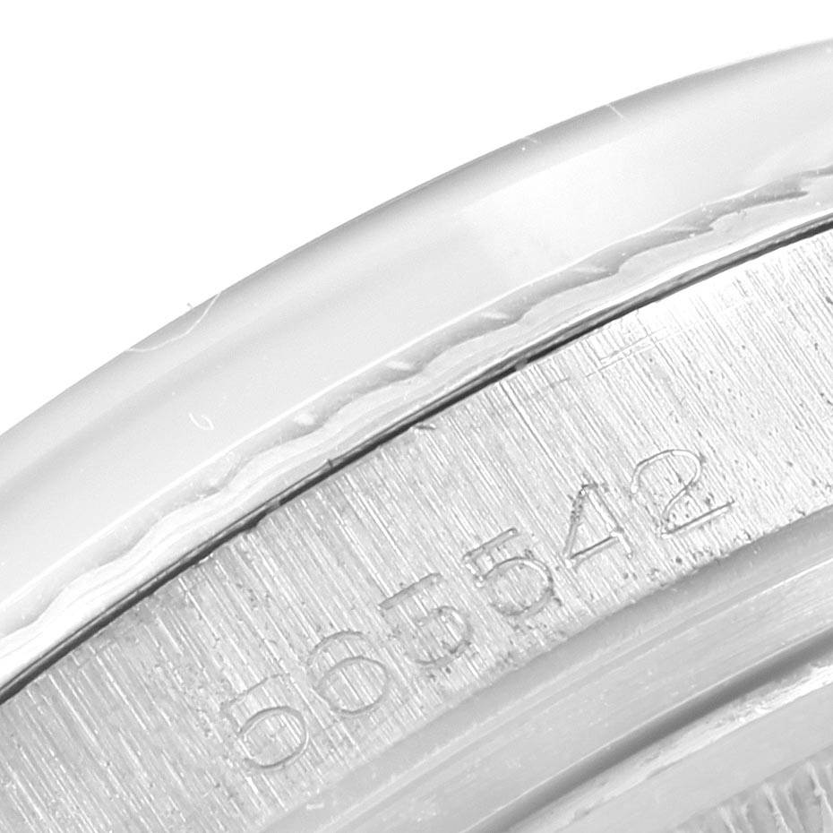 This image shows a close-up of the engraved edge of the Rolex Vintage Collection 1601 Men's Stainless Steel Silver Dial 1601 Men's Stainless Steel Silver Dial watch, including the serial number.