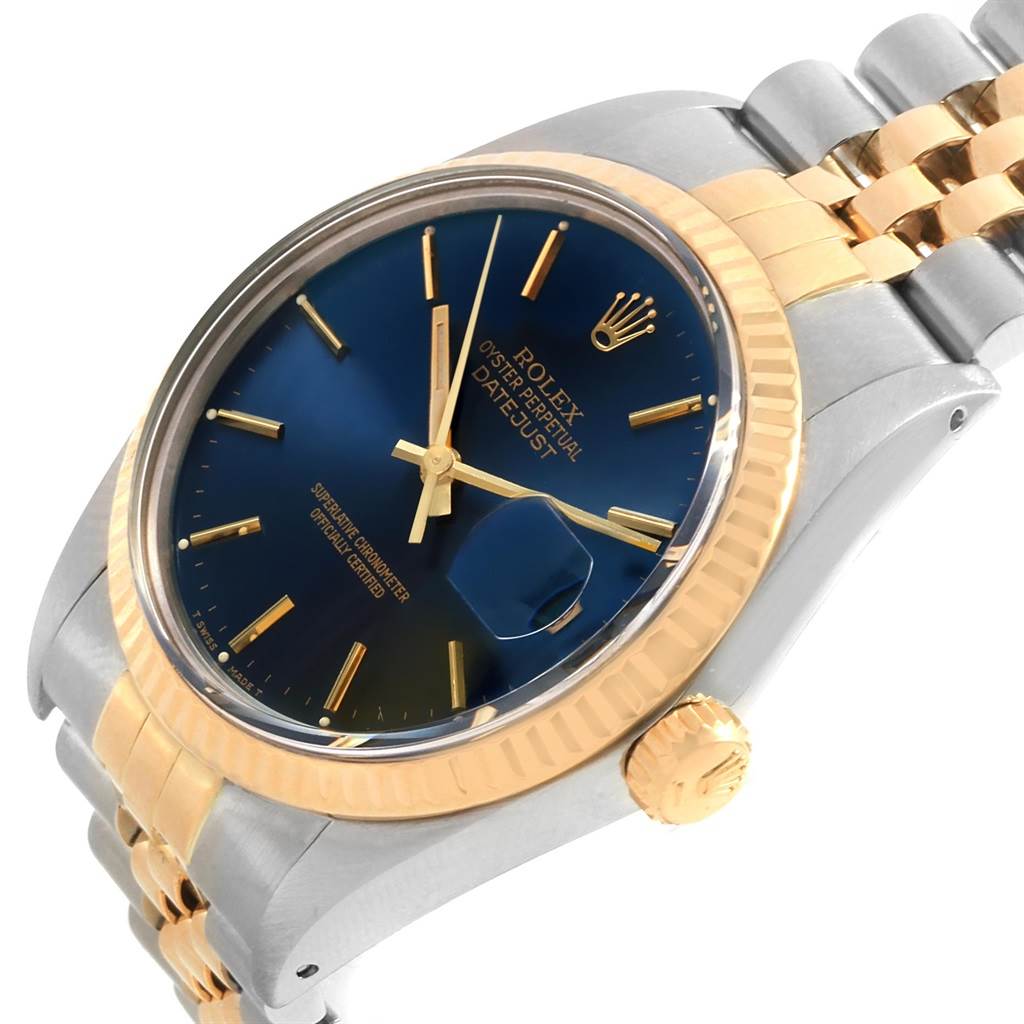 The Vintage Collection Rolex watch is shown at an angled view, highlighting its face, crown, and part of the bracelet.