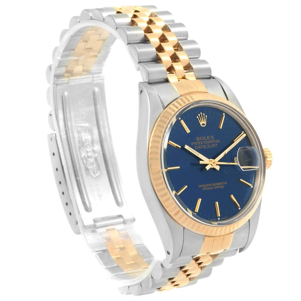This is a Rolex Vintage Collection 16013 Men
s Stainless Steel Blue Dial 16013 Men
s Stainless Steel Blue Dial model watch, showcasing its two-tone band, blue dial, gold bezel, and side profile.