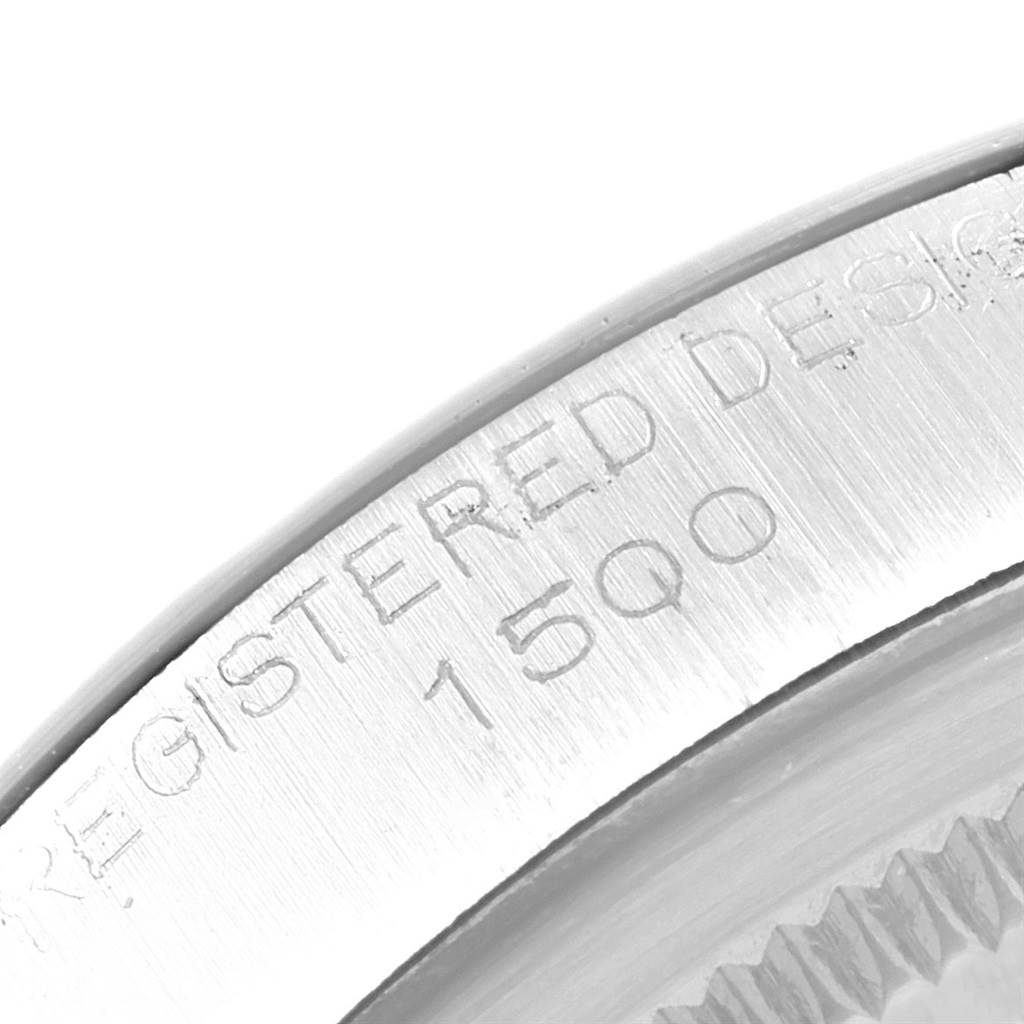 This image shows a close-up of the case back engraving and serial number on a Vintage Collection Rolex watch.