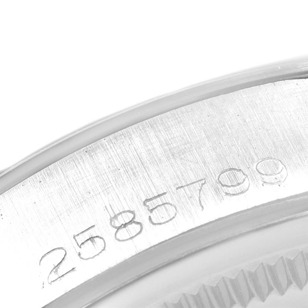 This close-up image of the Rolex Vintage Collection 15000 Men
s Stainless Steel Silver Dial 15000 Men
s Stainless Steel Silver Dial watch shows the engraved serial number on the case.