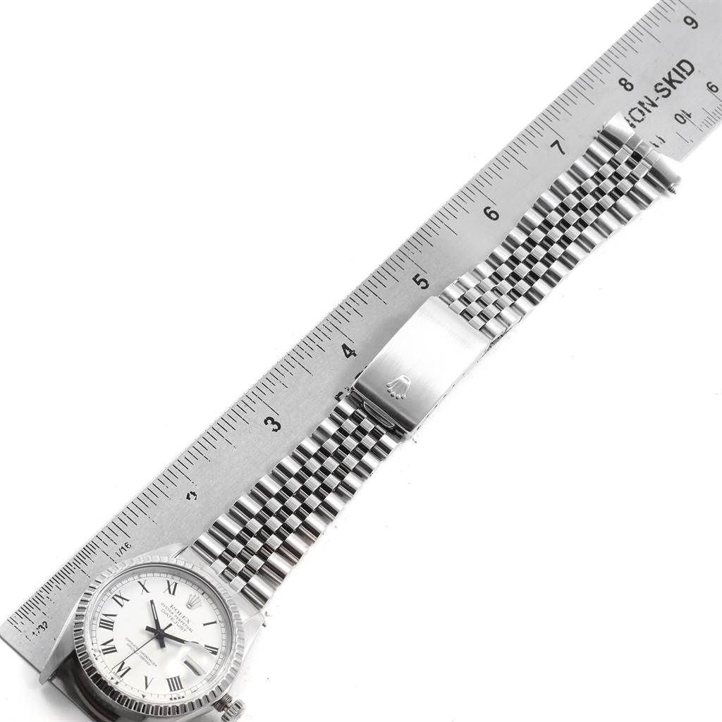 The image shows a top view of the Rolex Vintage Collection 16030 Men's Stainless Steel White Dial 16030 Men's Stainless Steel White Dial watch, including the face, band, and clasp next to a measuring ruler.
