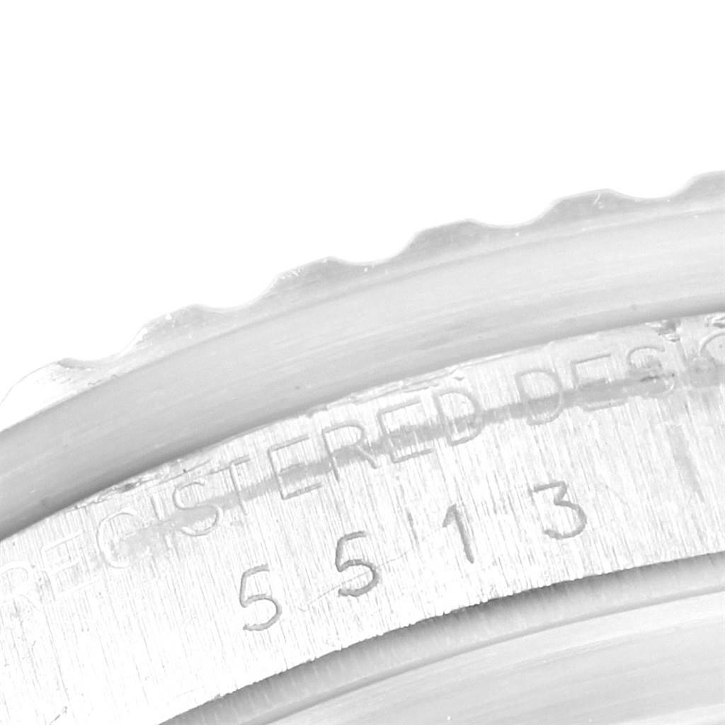 This close-up shows the engraved serial number and part of the bezel of the Rolex Vintage Collection 5513 Men
s Stainless Steel Black Dial 5513 Men
s Stainless Steel Black Dial model.